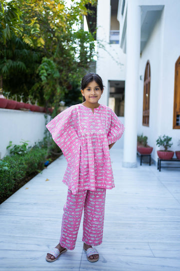 kid wearing pink fish cotton kaftan set