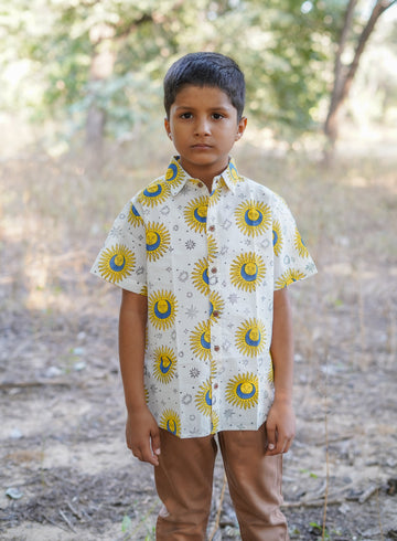 boy wearing pure cotton sun printed shirt