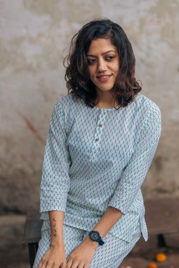 woman wearing green booti pajama set