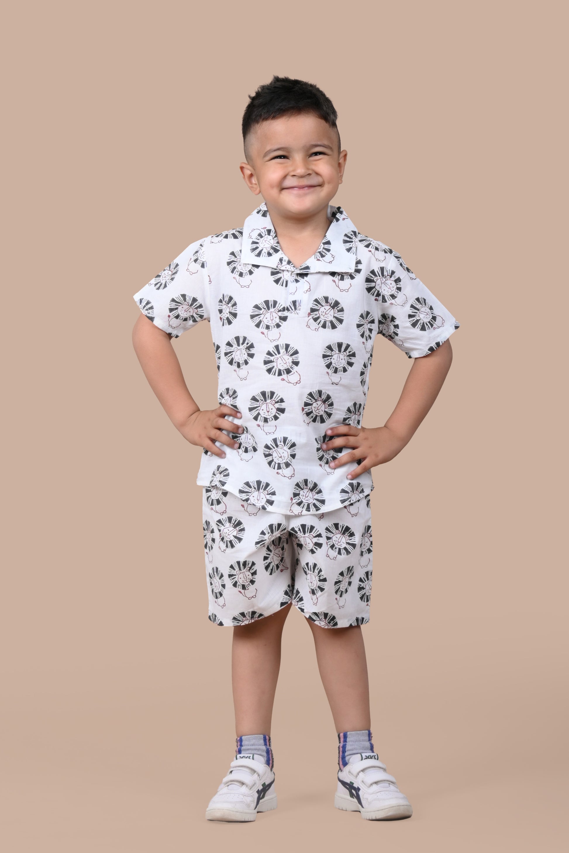 Boy wearing pure cotton Black Lion hand block printed shorts and top set by Chheent Jaipur