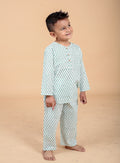 Boy wearing green booti hand block printed cotton pajama set - side view