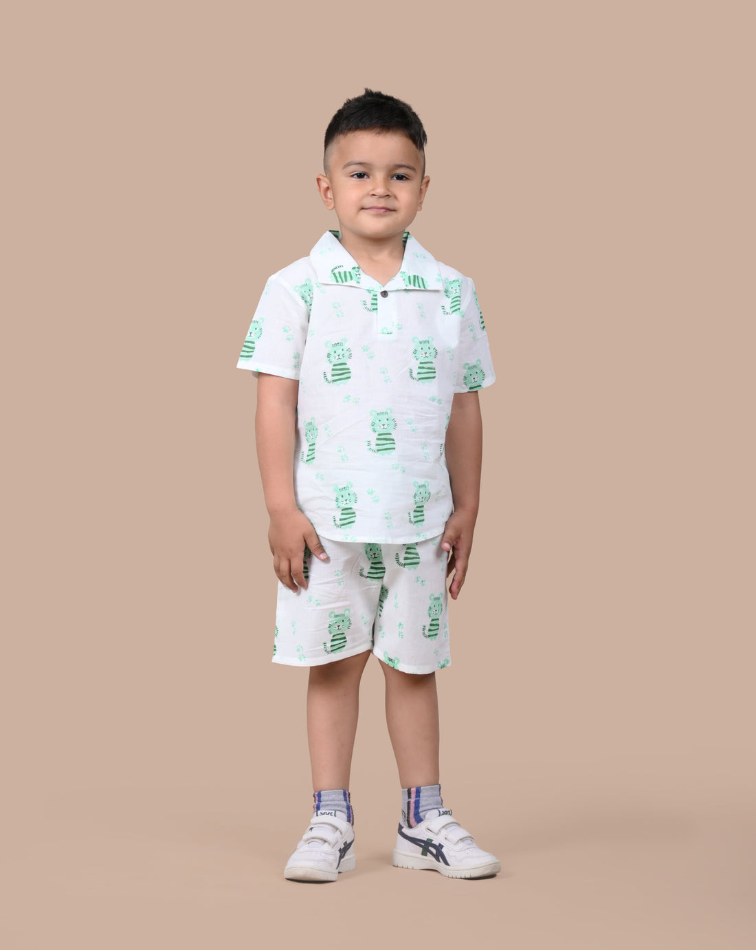 Boy wearing pure cotton Green Cat hand block printed shorts and top set by Chheent Jaipur
