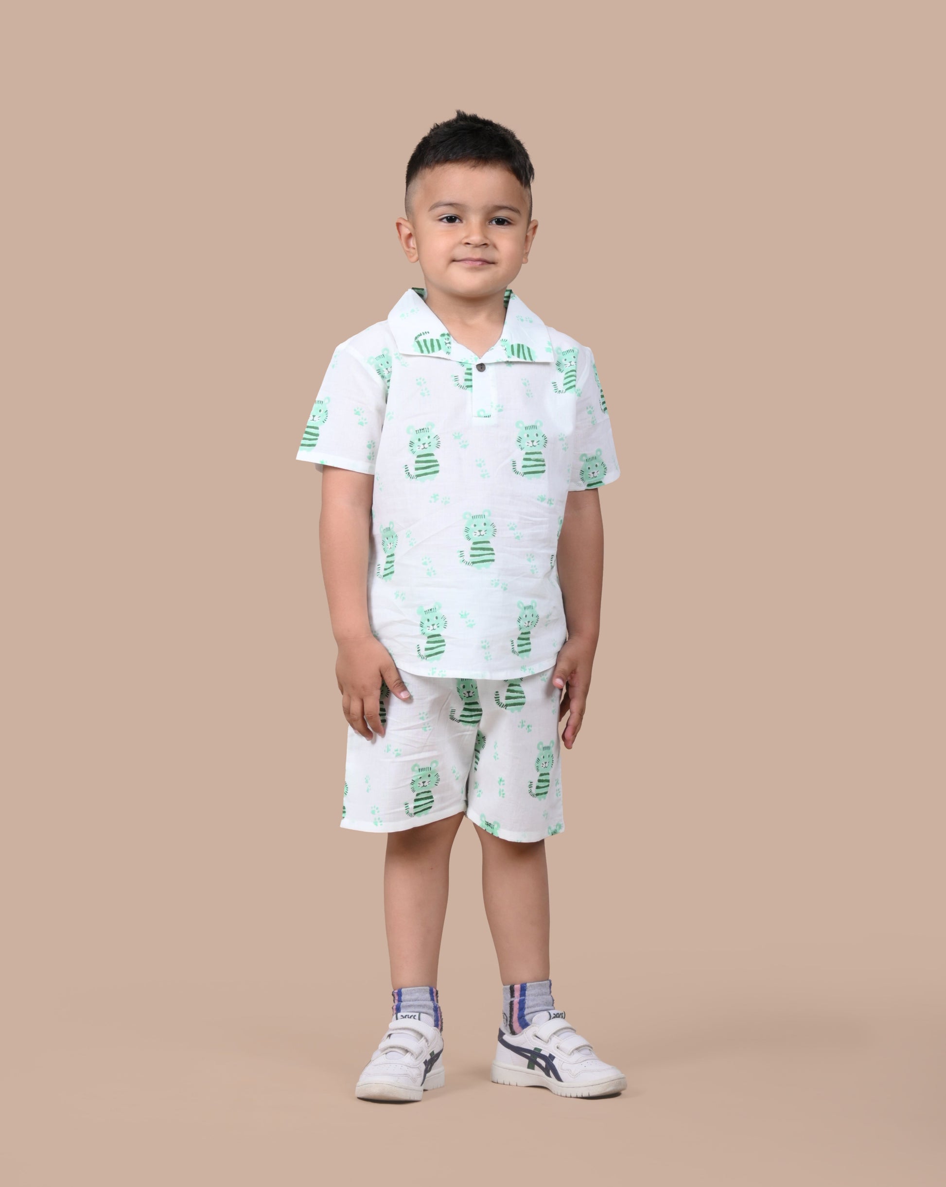 Boy wearing pure cotton Green Cat hand block printed shorts and top set by Chheent Jaipur