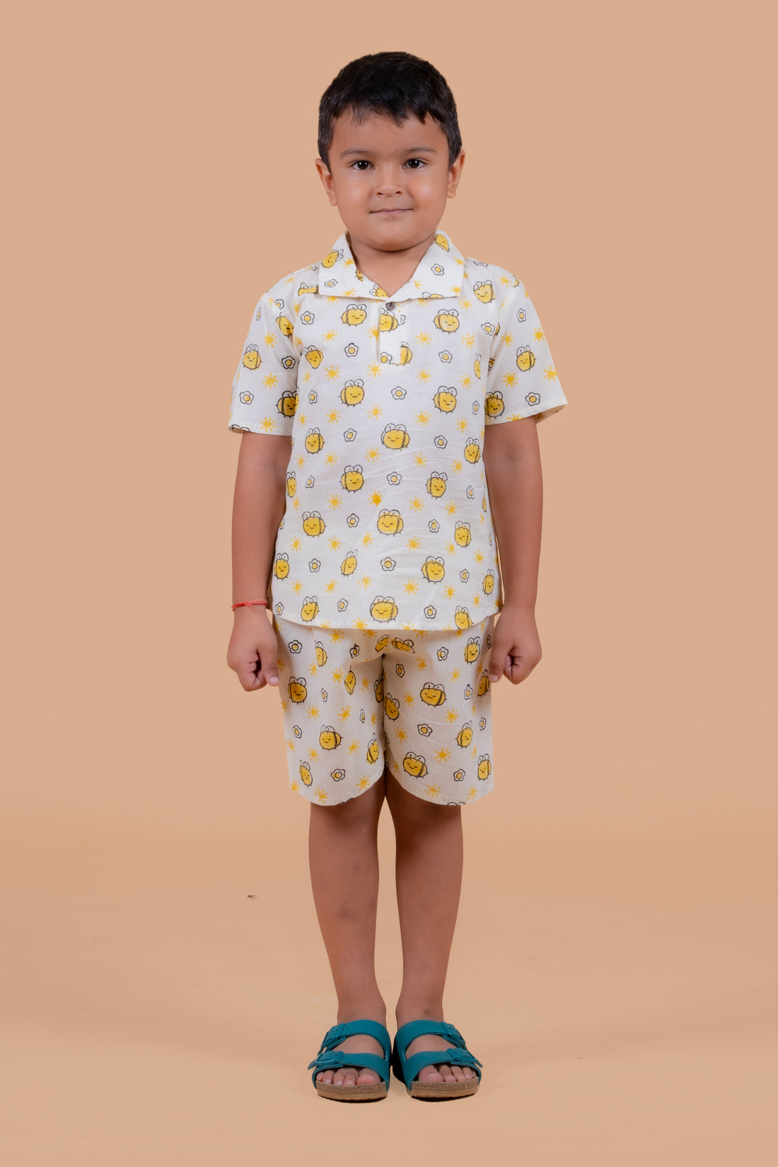 Boy wearing pure cotton Honey Bee hand block printed shorts and top set by Chheent Jaipur