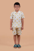 Boy wearing pure cotton Honey Bee hand block printed shorts and top set by Chheent Jaipur