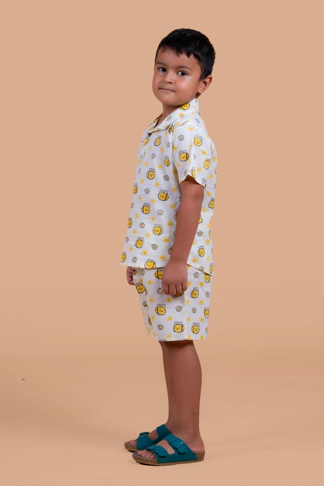 Boy wearing pure cotton Honey Bee hand block printed shorts and top set by Chheent Jaipur