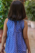 Girl wearing purple dot cotton shorts and top set, back outfit