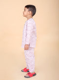 Boy in pure cotton purple fish print pajama set, side view