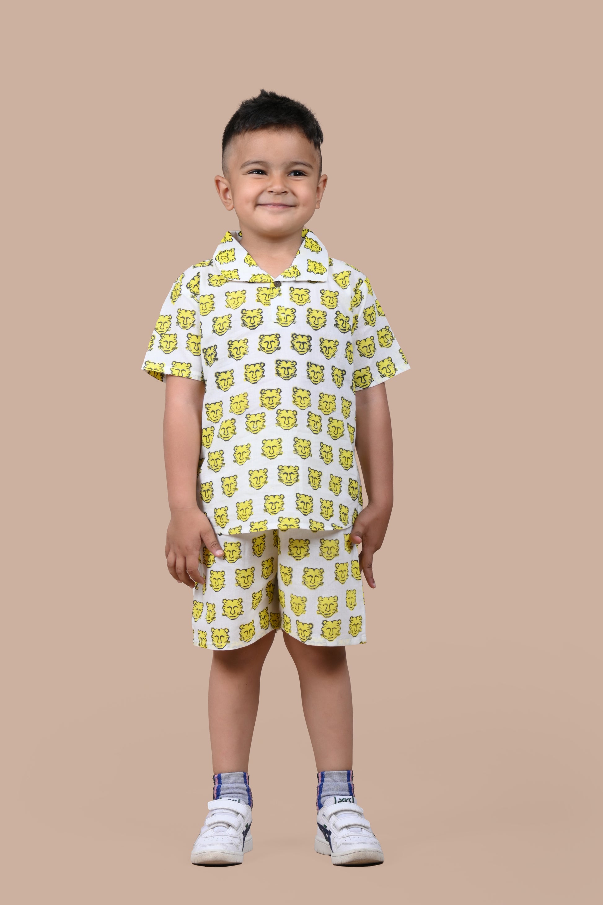 Boy wearing pure cotton Yellow Tiger hand block printed shorts and top set by Chheent Jaipur