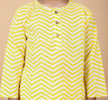 Close-up of yellow zig zag hand block print on cotton pajama top