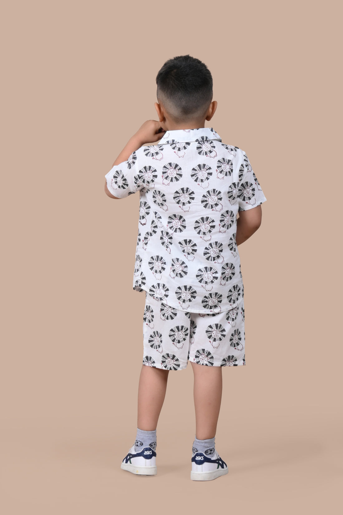 Boy wearing pure cotton Black Lion hand block printed shorts and top set by Chheent Jaipur
