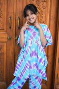 girl wearing blue purple ie and dye kaftann set