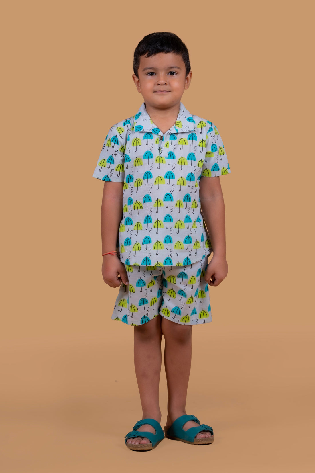 A boy is wearing grey umbrella print pure cotton shorts set 