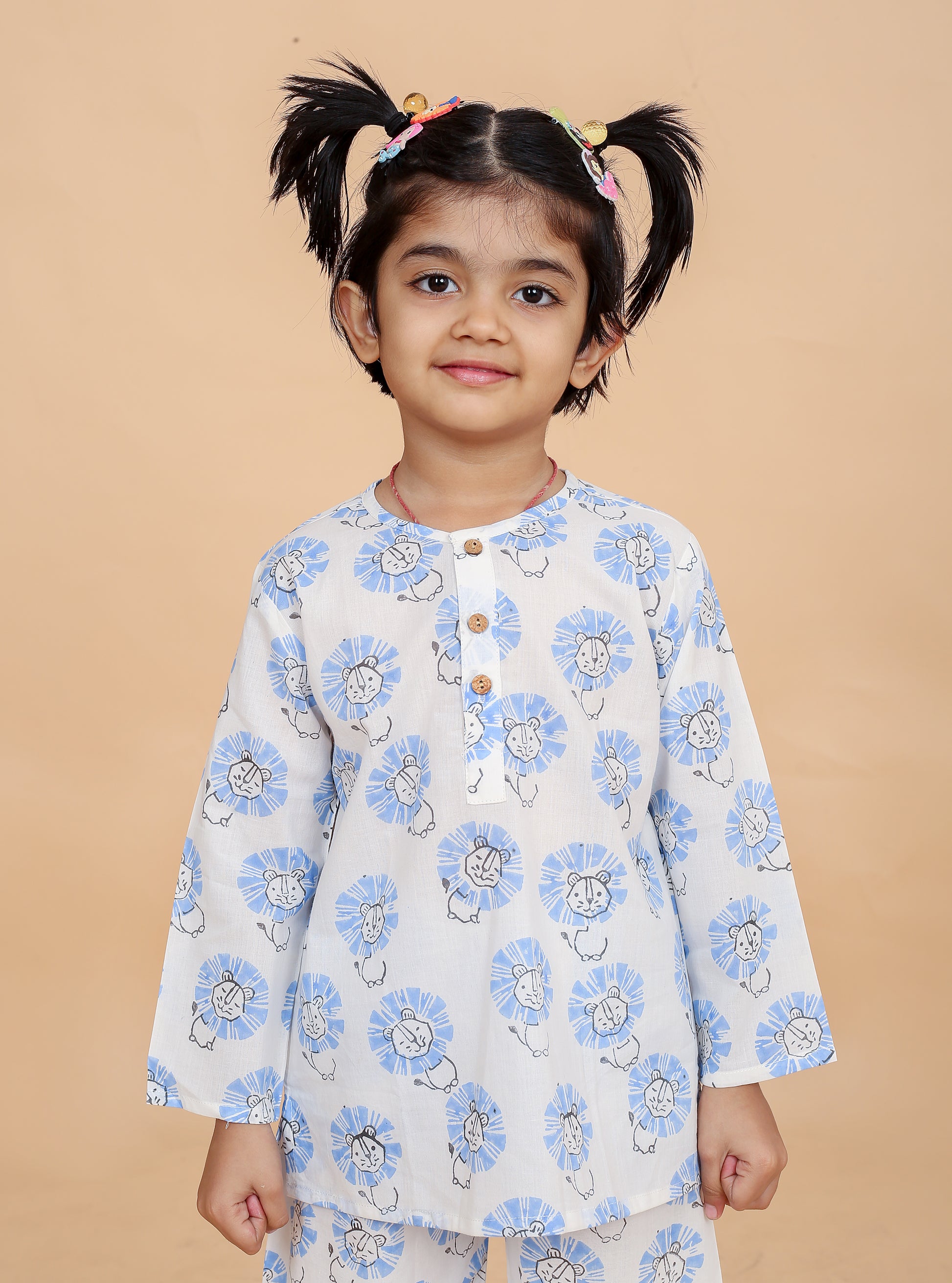 girl wearing blue lion printed nightsuit