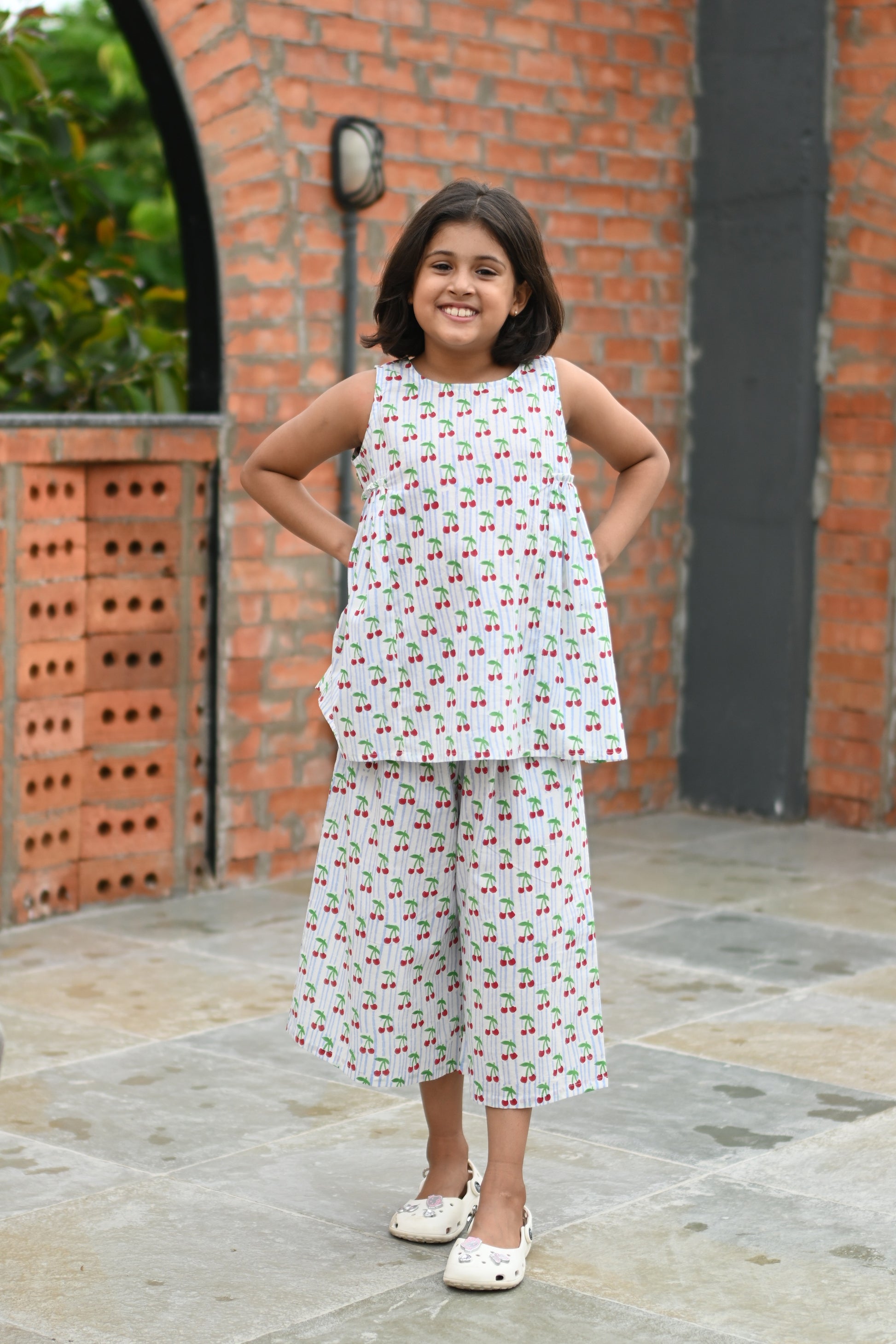 Cherry print pure cotton culottes set for girls, front view smiling – Chheent Jaipur