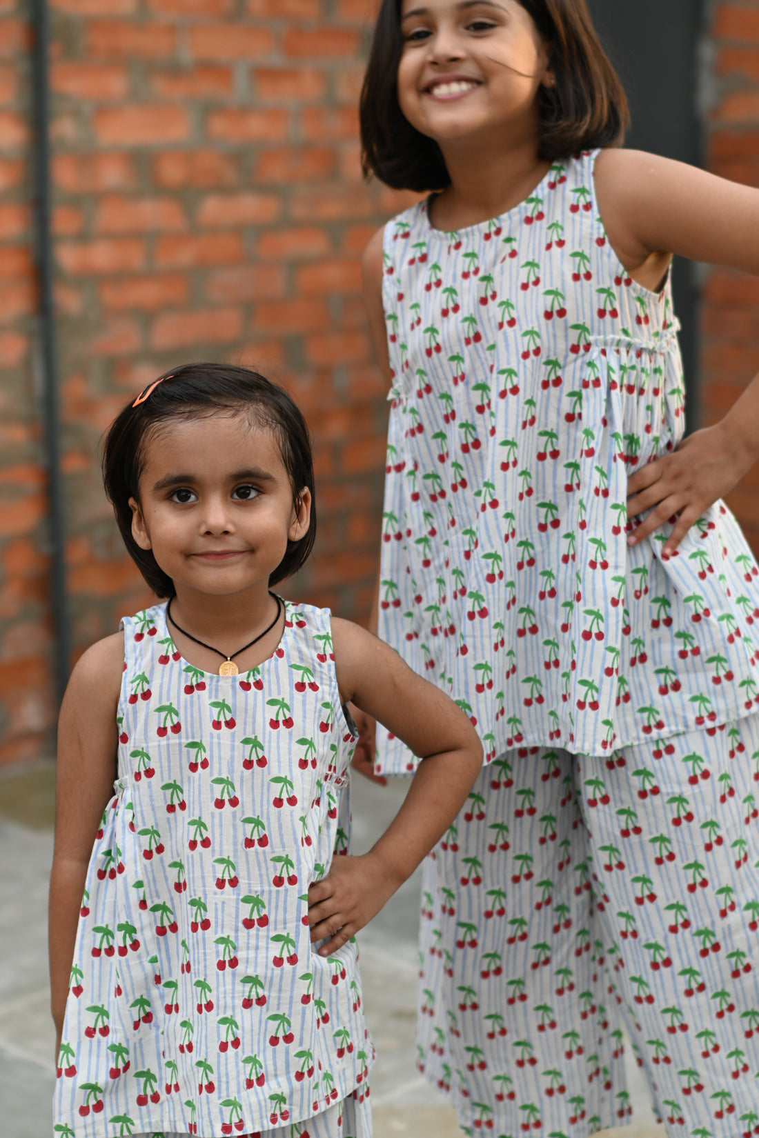 Cherry print pure cotton culottes set for girls, front view smiling – Chheent Jaipur