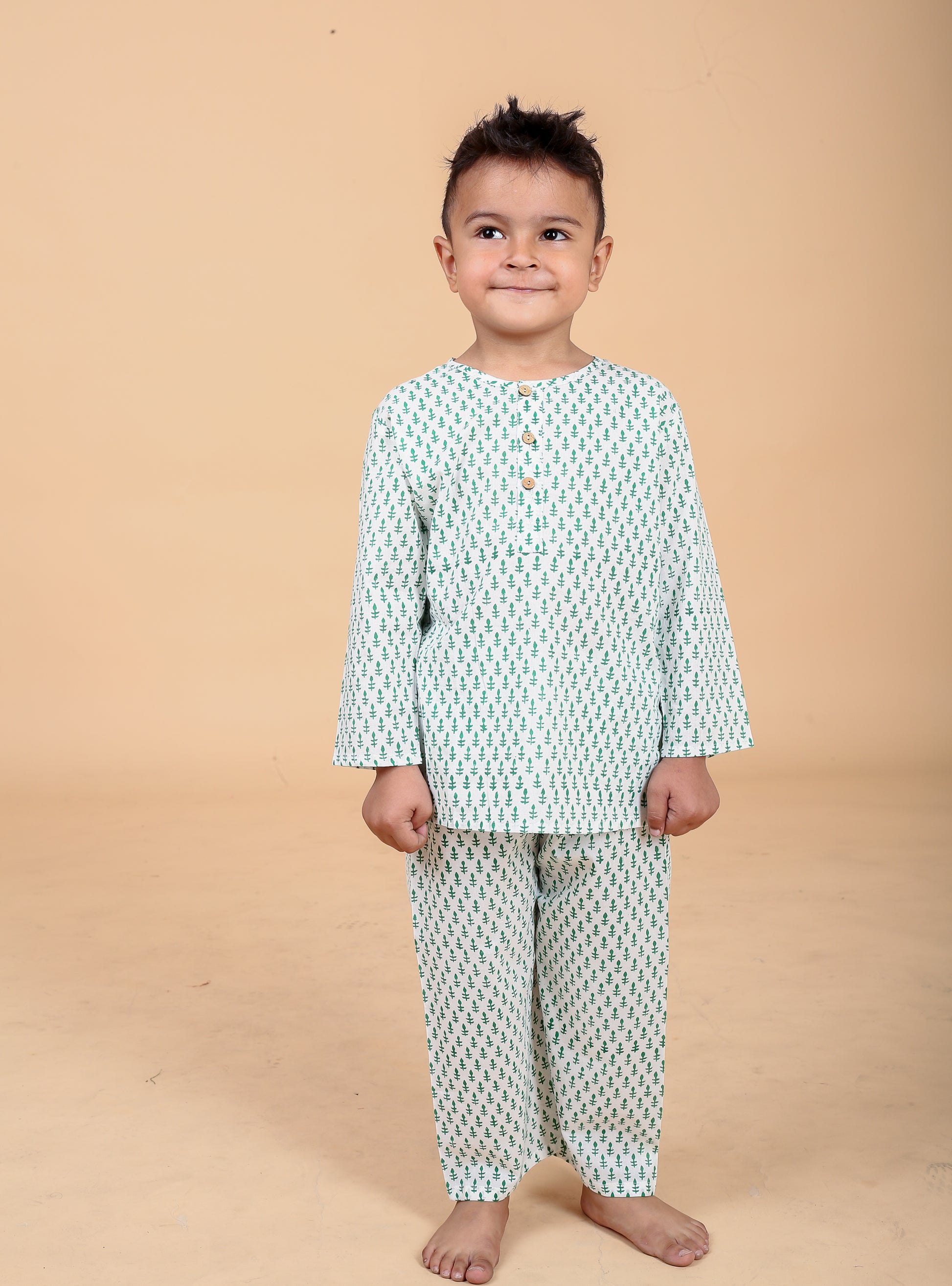 Boy wearing green booti hand block printed cotton pajama set- front