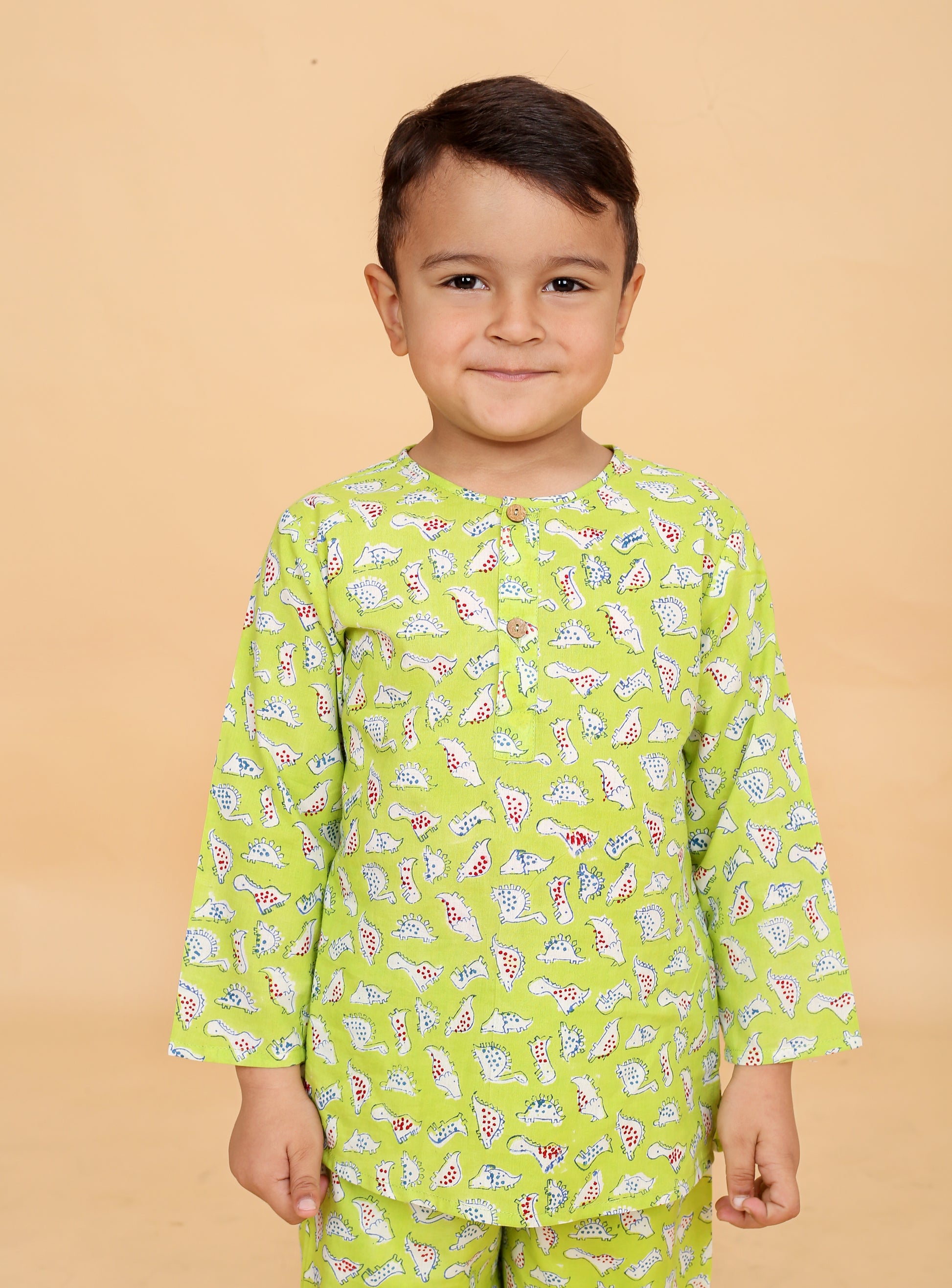 Green Dino pajama set fabric close-up - pure cotton hand block printed