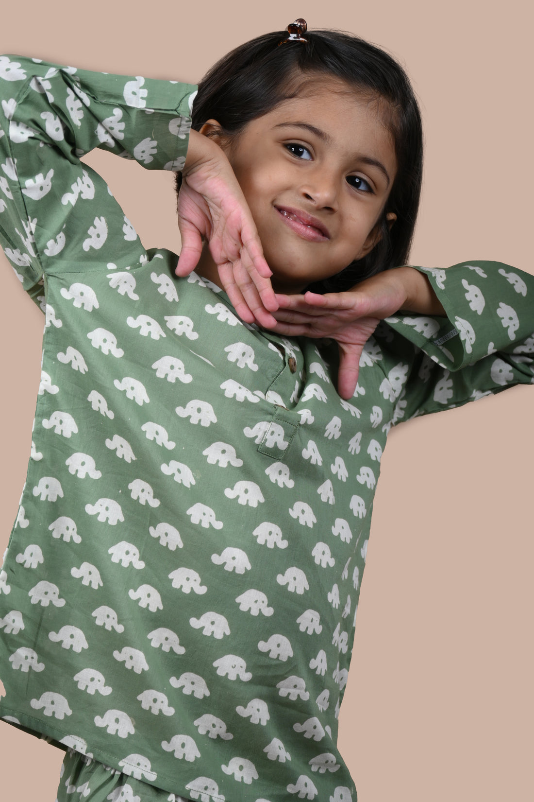 girl wearing dark green elephant printed cotton pajama set