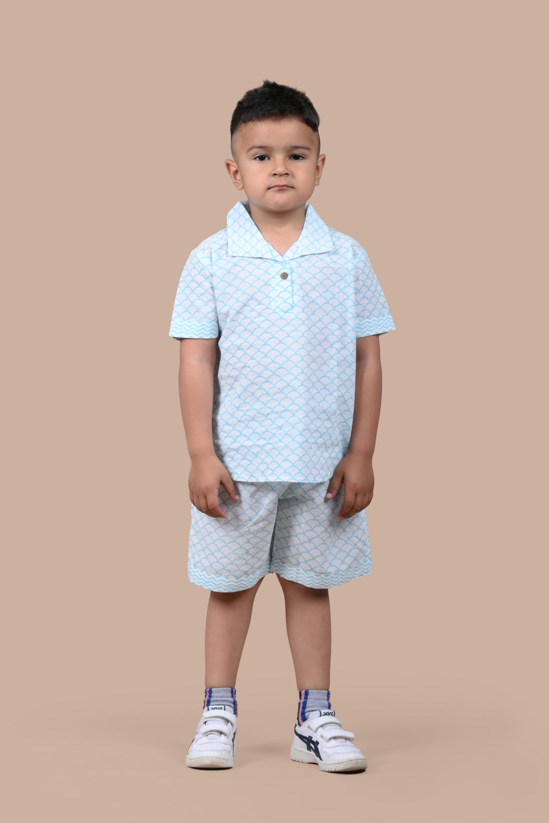 Boy wearing pure cotton Turquoise Scallops hand block printed shorts and top set by Chheent Jaipur