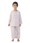 girl wearing pink flamingo printed cotton pajama set