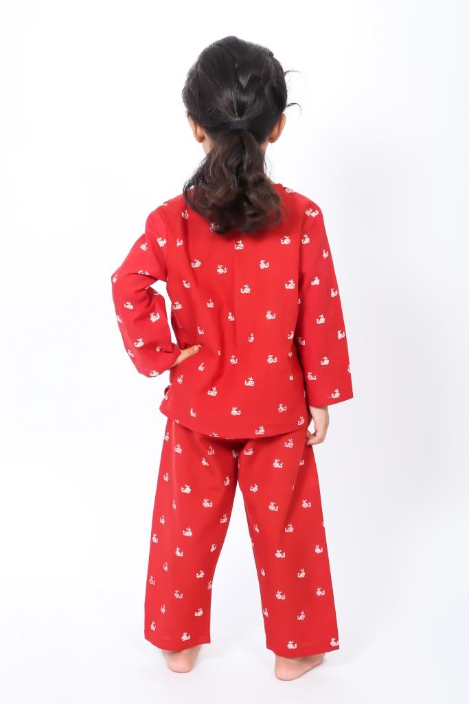 Girl wearing hand block printed red whale cotton night suit