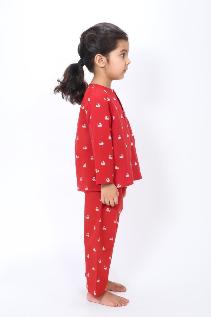 Girl wearing hand block printed red whale cotton night suit